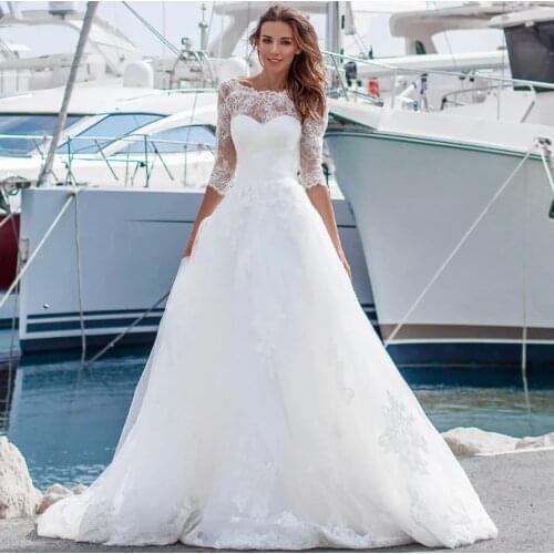 Wedding Dress Beach 2021 A-Line O-Neck 3/4 Sleeve Backless Lace Appliques Sequined Sweep Train Bride Gown Vestidos De Noiva