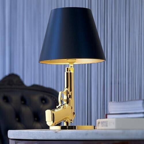 Nordic gun contemporary and contracted sitting room bedroom study personality resin gun lamp of the head of a bed room