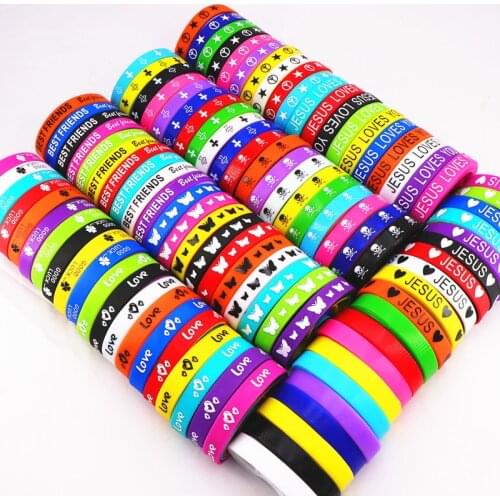 Pack of 100pcs Multicolor Elasticity Jesus Cross Skull Peace Butterfly Etc Style Wrist Cuff Silicone Bracelets For Man Women