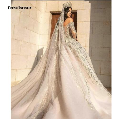 Romantic Ball Gown Wedding Dresses 2021 Long Sleeves Bridal Gown Backless Sweetheart Royal Train Beaded White Plus Size Bride