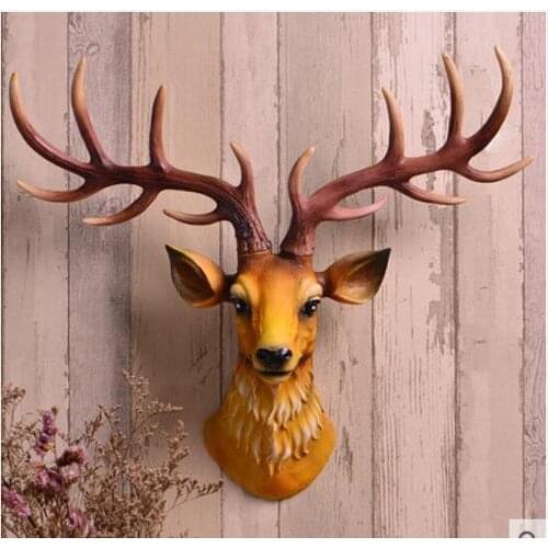 Garden simplicity of modern North European deer head hanging on the wall of simulation mural decorations inside the living room
