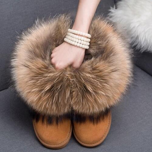 All-in-fur snow boots female natural cow suede low short winter shoes with large raccoon fur trim furry boots