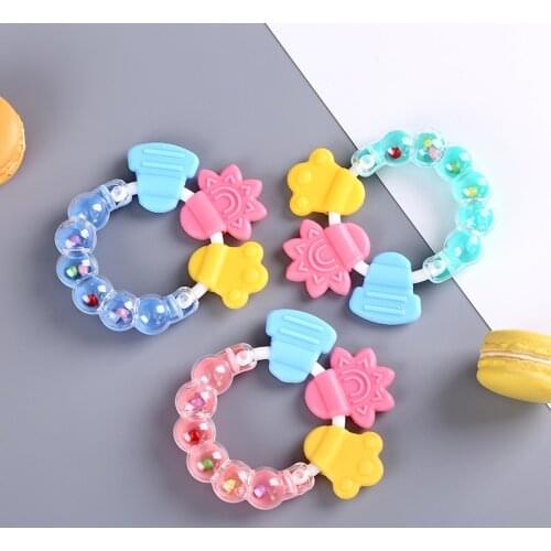New born Baby rattles Teether toy Teeth Biting For Babies Baby Rattle toddler Bed Bell Silicone Handbell Jingle Cartoon random
