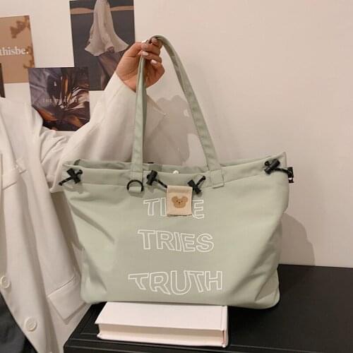 2021 new large-capacity portable shoulder bag female drawstring nylon canvas tote bag Japanese Korean backpack