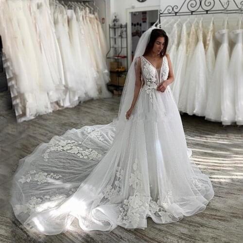 2020 New Beach Wedding Dresses Deep V Neck Backless Lace Appliques Court Train A Line Sleeveless Bridal Gowns Robe De Mariee