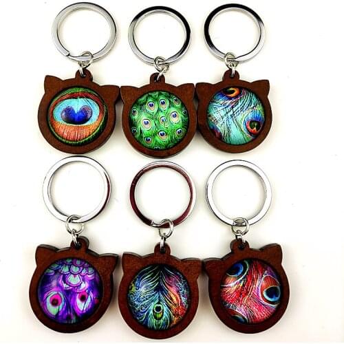 Jiangzimei 24pcs New Style Peacock feather 25mm glass Cabochon with Cat ears Wood Cabochon Keychain for party gift