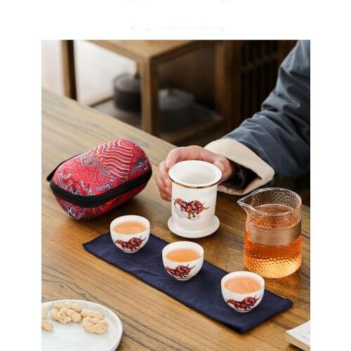 Hot suet jade auspicious cattle you paint crack mini outdoor travel bag filter cup a kung fu tea set ceramic pot of three cups
