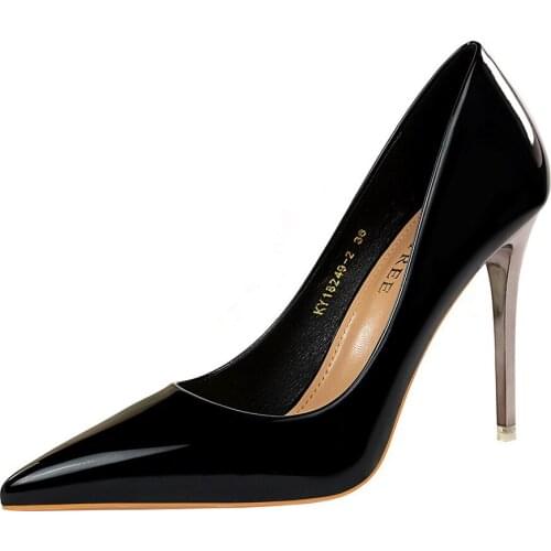 Metal heel super high-heeled shiny patent leather shallow mouth pointed sexy nightclub was thin high-heeled shoes
