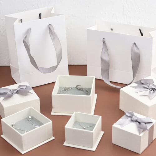 10Pcs New Creative White Kraft Paper Jewelry Packaging Boxes With Grew Bow Grey Sponge Inside Gift Package For Ring Earrings