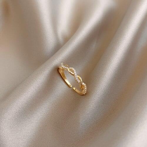 Fashion jewelry high-end exquisite copper inlaid zircon hollow twisted ring elegant temperament womens index finger open ring