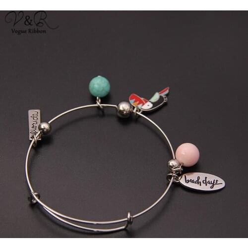 Rhodium plated stretch bracelet with toucan/ acrylic ball/ pink ceramic ball/ beach alex and ani bracelet