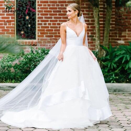 Simple V Neck Satin Wedding Dresses Spaghetti Strap Illusion Back Wedding Gown Tiered Tulle Robe de mariée Empire Waist Robe