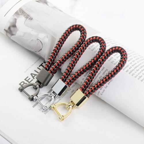 High-end woven leather car keychain men and women rotating golden horseshoe buckle key ring holder charm bag chain pendant