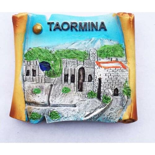 QIQIPP A magnet fridge of tourist souvenirs in the ancient city Taormina, Sicily, Italy, is attached to the creative collection