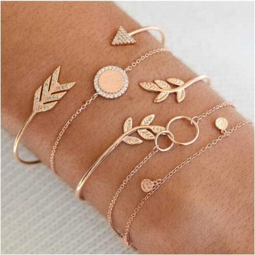Pack of 5 inspired bangle bracelet with arrow/leaf embossed and coin pendant design in mixed link chains in gold tone