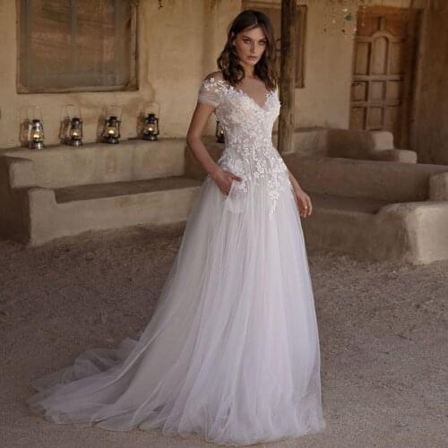 O Neck Wedding Dresses A Line Wedding Gowns Lace Appliques Short Sleeve Tulle Bridal Gown Backless Robe De Mariee with Pockets