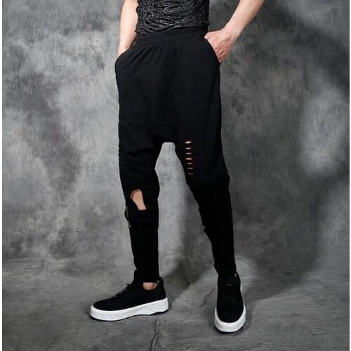 Personality hole harem pants men skinny pants vintage retro finishing cutout feet trousers mens casual pants hollow male black