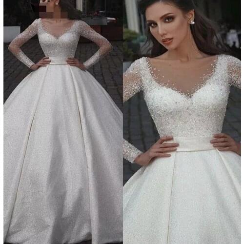 Hot Custom Made Luxury Arabic Dubai Wedding Dress 2021 Illusion Neck Pearls Beading Long Sleeve Bridal Gowns Robe De Mariee