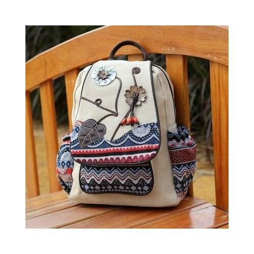 Fashion National string appliques women shopping backpacks!Nice floral embossing lady cover backrack All-match canvas backruck