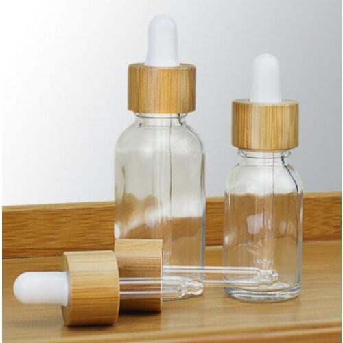 5 10 15ml 30ml 50ml clear glass bottles custom logo dropper essential oil bottles with bamboo dropper cap e liquid bottle 50pcs
