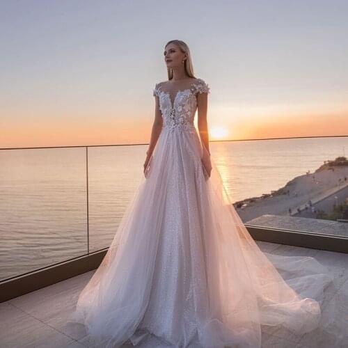 Luxurious Sheer Scoop Neckline Wedding Dresses 2021 Applique Sequins Tulle Sweep Train See Through Back Beach Bridal Gowns
