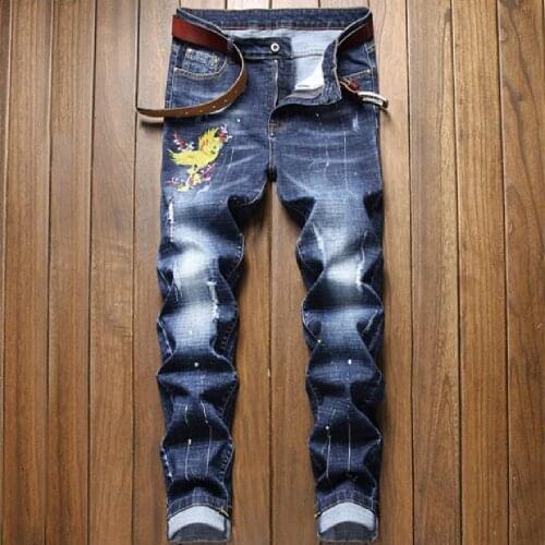 Mans jeans new European and American trend slim small straight tube fashion retro blue individual character embroidered jeans
