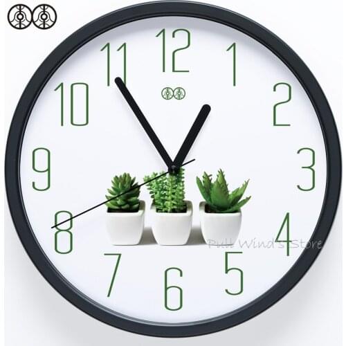 Brief small fresh home wall clock Green plant logo creative office wall clock