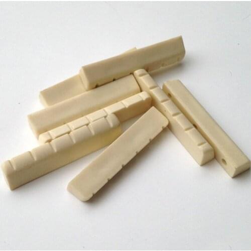 2 pcs/set Acoustic Guitar Wooden Guitar Emulation Beef Bone Strings Bridge Pillow(1 pcs Bridge 1 pcs Pillow)