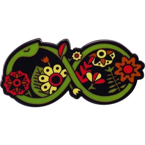 Wear the floral “Snake” totem pin as an amulet to remind you of your creative power