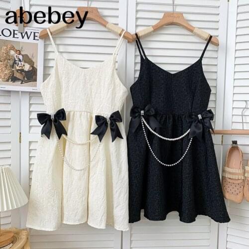 Temperament V-neck sleeveless off shoulder Dress bow pearl chain decoration high waist pleated short Dress 2021 New Summer