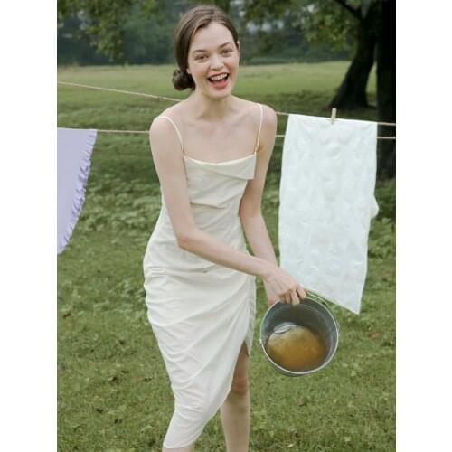 Sling Dress in the Summer of 2021, the Waist Was Thinner, the Long Design, the White Irregular Sexy Sling Dress