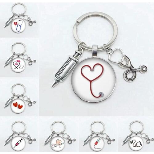 Creative Doctor Injection Stethoscope Picture Keychain Round Dome Pendant Men And Women Fashion Stethoscope Syringe Alloy Keycha