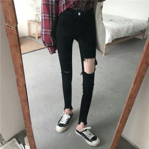 Chinese new womens pants personality street fashion hole cut cut high waist stretch black jeans pants spot