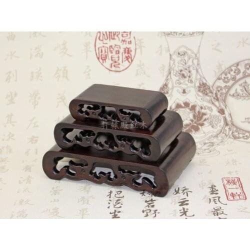 Sets of three red agate jade carvings odd teapot ornaments crafts solid wood base several books black Zi Mu