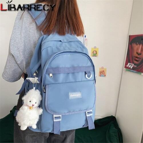2021 Letter Design Ladies Backpack Soild Color Designer High Quality Nylon Ladies Student Backpack Cute Pendant Design Women Bag