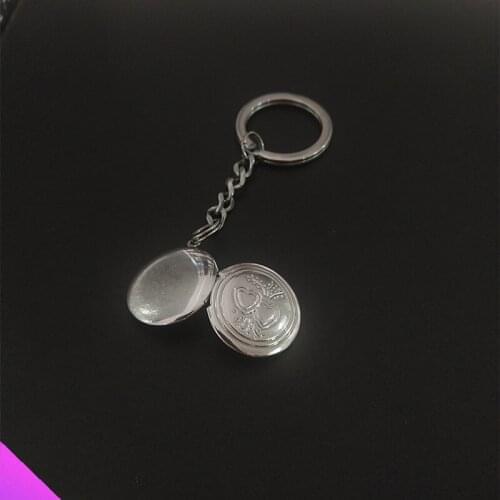 The new keychain link two heart-shaped round photo frames free laser engraving photo box jewelry pendant gif