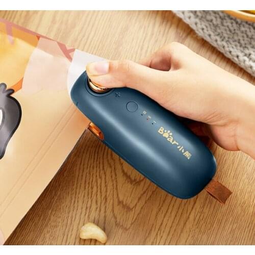 Snack sealing small household plastic bags hand in hand pressure type electric heat sealing device J03