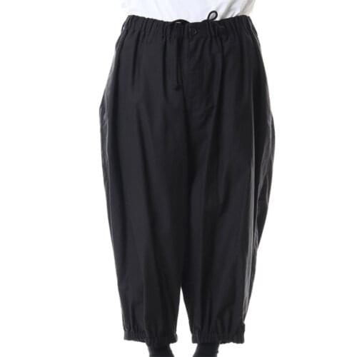 The new mens casual pants for spring are black wide-leg pants with loose elastic-waist straps