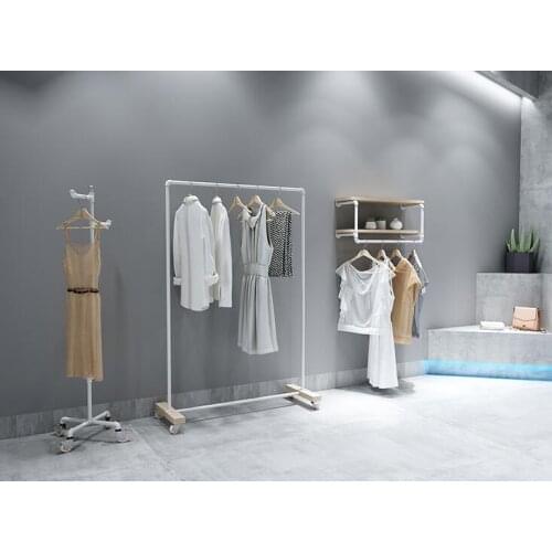 Clothing store display rack. Clothes rack womens shop floor-to-floor hangers. Solid wood Textile Gondola simple white gantry