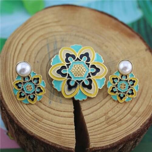 Custom retro exotic totem flower enamel pearl brooch 925 silver needle embossed flower earrings ear clip