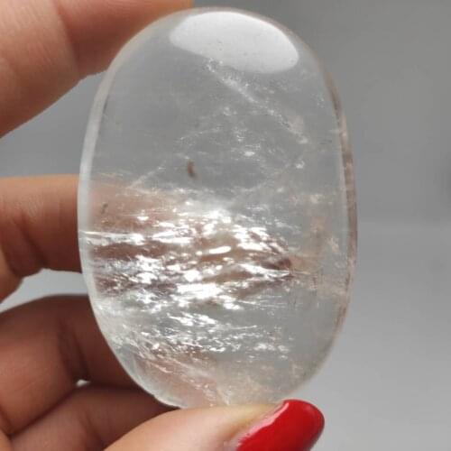 White quartz crystals palm stones natural minerals massage healing polished