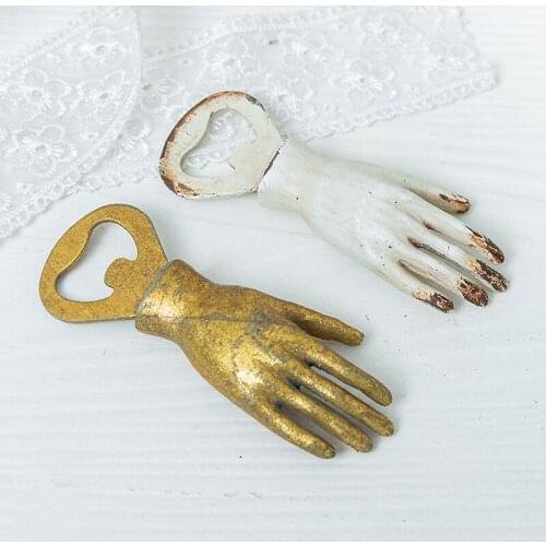 A pair retro handcrafted vintage metal bottle opener