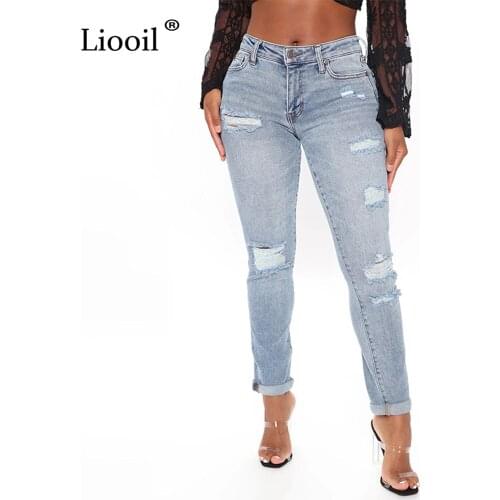 Liooil Hole Light Blue Denim Pants Women 2021 Mid Waisted With Button Zipper Pockets Female Sexy Skinny Washed Ripped Jeans
