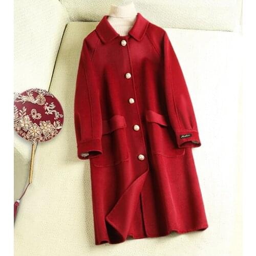 High end double-sided cashmere coat women 2020 spring new baby collar pearl buckle Korean wool coat medium length