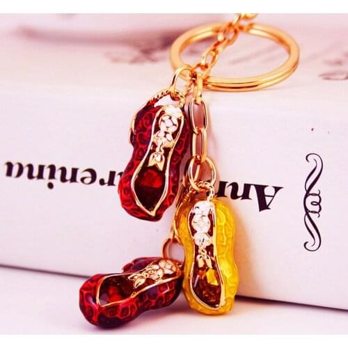 Fashion dripping craft wedding gift peanut key chain ladies bag accessories personality metal pendant key chain