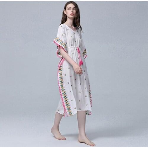 The new Bohemian dress is a long dress for women holidaying in sexy beach embroidered bobo balls