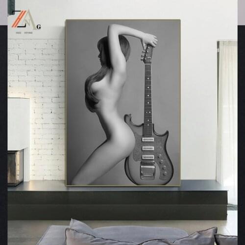 Modern Nordic style beauty carrying a guitar wall art posters used to decorate the cloth paintings of homes or bars and hotels