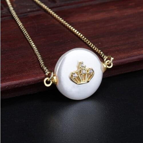 Tiny white cubic zircon paved gold crown charm on flat round coin pearl connector bead thin link bracelet for woman