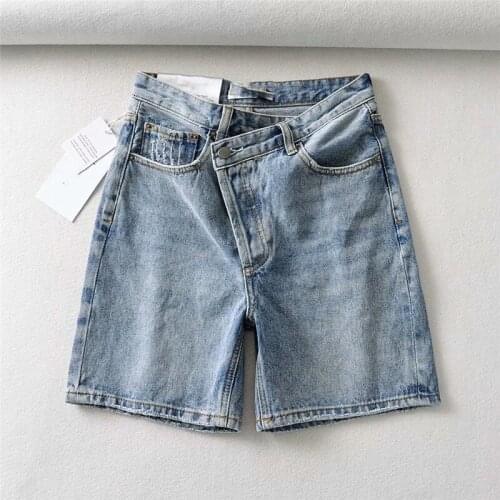 Spring and summer new style street solid color oblique placket denim shorts women, high waist slimming button denim shorts women