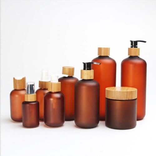 Biodegradable wooden cream jar Bamboo Cosmetic packaging PET 4oz 8oz 16oz frosted amber plastic bottle with bamboo lotion cap